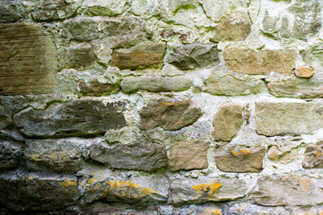 texture of masonry, a fragment of a stone wall of an ancient temple of the 10th century, background, backdrop