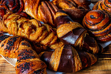 Large assortment of baked goods on a wooden background.