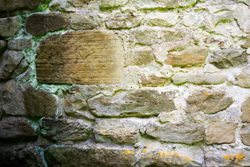 texture of masonry, a fragment of a stone wall of an ancient temple of the 10th century, background, backdrop