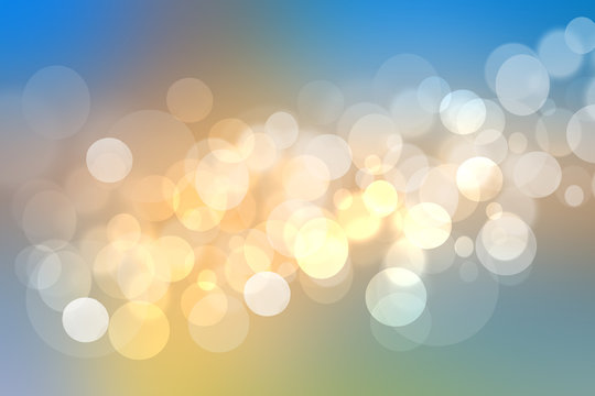 Abstract golden festive background texture with white and blue lightening bokeh circles. Beautiful texture.