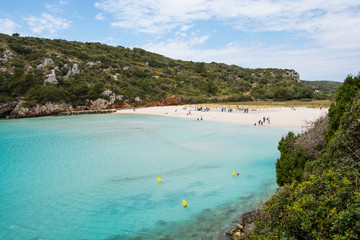 The beautiful beach of Cala en Porter photographed from the rocks.