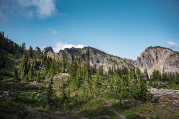 Dramatic skies over jagged peaks in the Alpine Lakes Wilderness. Central Cascade Mountain Range, Washington State, July 2019.