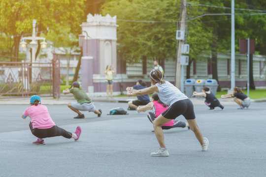 Group Of Elderly Friend Doing Aerobic Dance After Work   Together At Lumpini Park In Bangkok, Thailand.