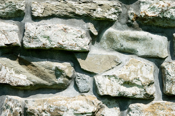 texture of masonry, a fragment of a stone wall of an ancient temple of the 10th century, background, backdrop