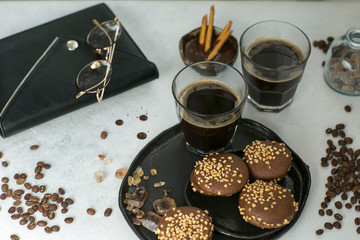 cup of coffee with cookies and sugar