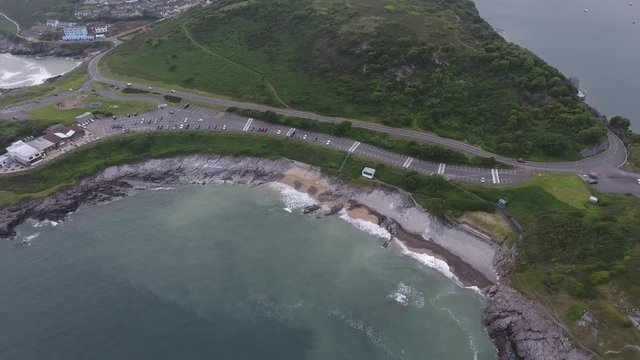 Editorial Swansea, UK - June 17, 2019: Aerial view of the award winning Bracelet Bay and car park, popular for watching the sunrise on the Gower peninsula in Swansea, South Wales, UK
