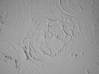 Swirly patterned ceiling plaster pattern known as Artex was common in the 80s.