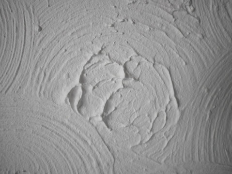 Swirly patterned ceiling plaster pattern known as Artex was common in the 80s.