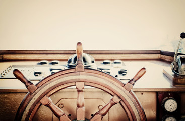 vintage nautical detail of a ship's old wooden wheel