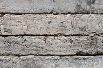 Old concrete blocks wall background closeup