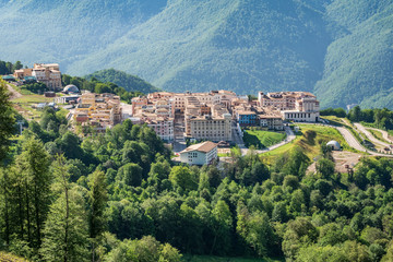 View of the hotel complex in the mountains covered with green forests