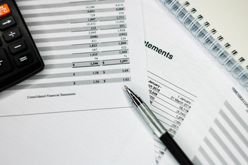 Financial analysis - income balance statement, business plan with glass. Business composition of Investment portfolio.