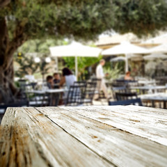 Table background  in a restaurant outdoor view. Empty  space for your decoration and an advertising product.