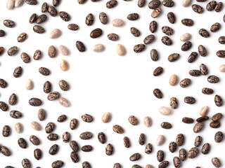 chia seeds on white background top view. Pattern of healthy chia seeds with copy space for text or design. Isolated on white with clipping path. Top view or flat lay.