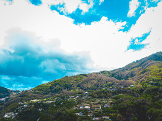 buildings in the mountains at ischia island from the drone view