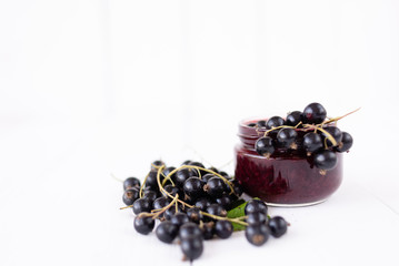 black currant berries lie on a white table, groceries