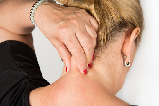 Mature Women With Neck Pain. Self Massage Concept