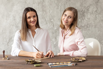 Fototapeta premium Individual drawing training. Beautiful bright studio with sunlight. Selective focus.