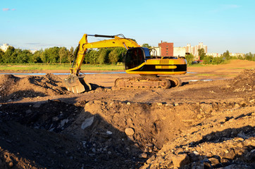 Excavator with crusher bucket for crushing concrete. Construction waste recycling for construction...