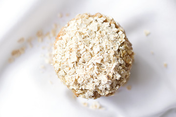 Healthy cupcake with oats on top on a tablecloth