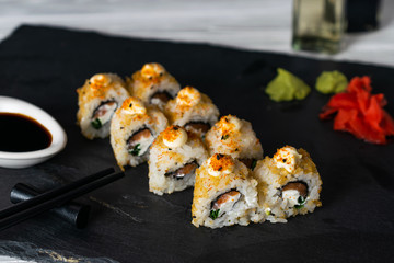 Sushi rolls filled with salmon fish and cream cheese