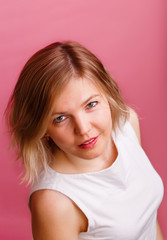 Fototapeta premium Photo of blonde in white T-shirt looking at camera