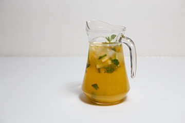 lemonade in a jug on a white background