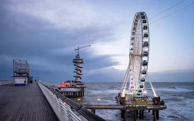 Fotobehang Popular ferris wheel on the pier of Scheveningen, The Hague. © Erik_AJV
