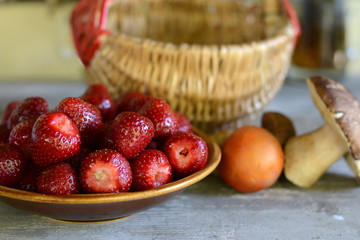 fresh strawberry in the plate on wooden table.