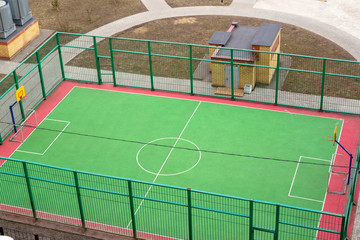 Obraz premium View of the sports ground in the courtyard of residential buildings