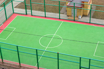 View of the sports ground in the courtyard of residential buildings