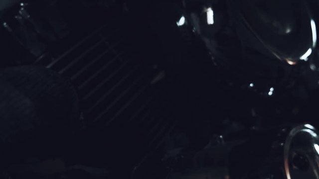 American chopper. the camera moves along the motorcycle while focusing on its chrome parts
