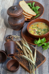 Fresh liquid pea soup on chicken broth. bean soup with parsley. healthy breakfast. vertical photo