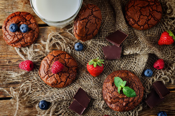 Chocolate brownie cookies with berries and mint leaves