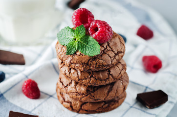 Chocolate brownie cookies with berries and mint leaves