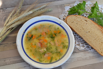 Pea soup in the vintage bowl on shabby table