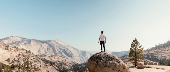 A man on a stone in yosemite national park