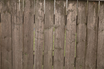 Textured brown old wooden plank background.