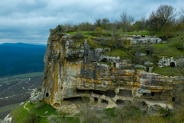 Fototapeta na wymiar Flying drone above the cave city Tepe-Kermen, near the city of Bakhchisaray, Crimea