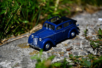 Obraz na płótnie Canvas Moskvich 400-420 blue 1947 The legendary Soviet car scale 1/43. The collection model of a car of the USSR is a passenger Soviet car of the Moscow plant for the production of small cars (MZMA). Cabriol