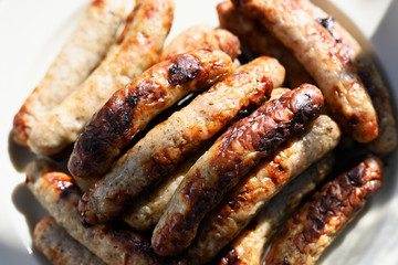 Several sausage sausages on a plate.