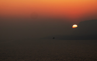 Birds and mountains in the red sunset.Vögel und Berge im rotem Sonnenuntergang