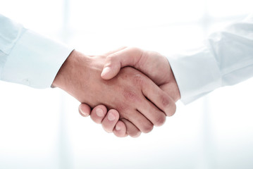 close up.handshake of business people on a light background