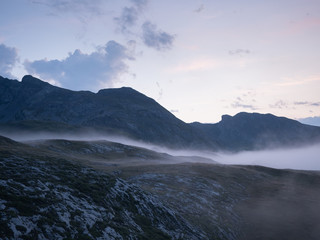 Hills of Pyrenees being covered by fog