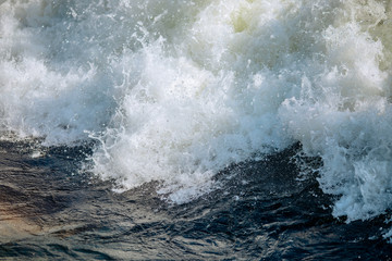 Bursts and rapids of close-up mountain river, waves and splashes