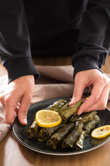 olive oil stuffed leaves on the plate with vegetable for service for restaurant concept from Turkey.