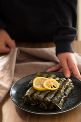 olive oil stuffed leaves on the plate with vegetable for service for restaurant concept from Turkey.