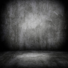 Grunge interior room with concrete wall and floor. Empty concrete space.