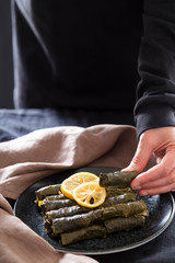 olive oil stuffed leaves on the plate with vegetable for service for restaurant concept from Turkey.