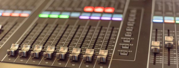 Panoramic view colorful sound mixer control DJ turntable close-up